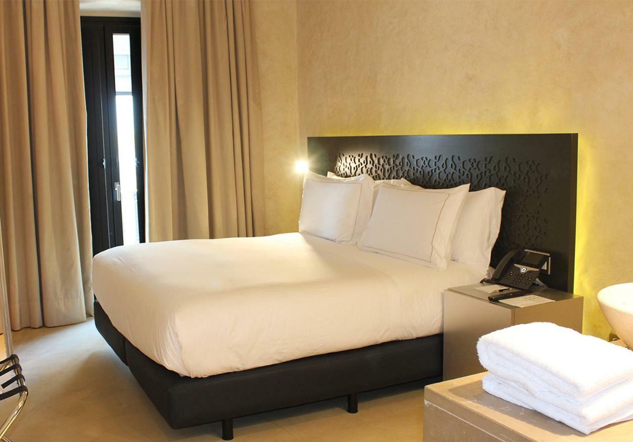 Eme Catedral Mercer Hotel Sevilla Eksteriør bilde A bedroom at the hotel