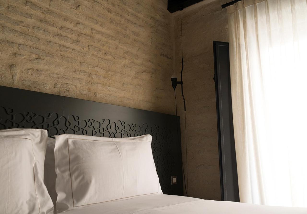 Eme Catedral Mercer Hotel Sevilla Eksteriør bilde A bedroom at the hotel